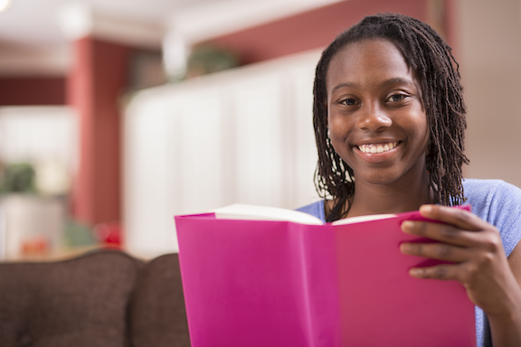 Black girl reading a book